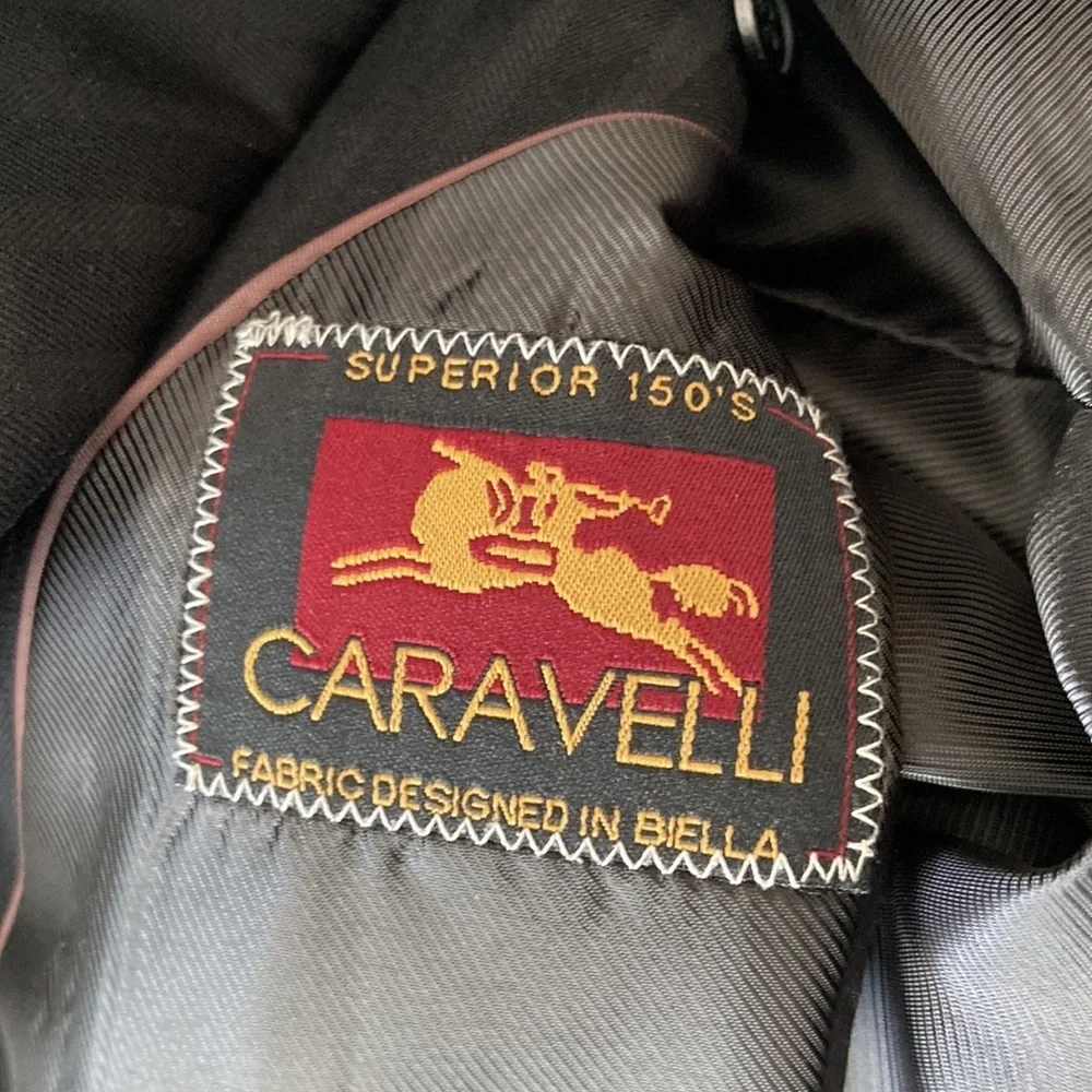 Caravelli Black Stripe Four Button Two Piece Single Breast Suit. Size 44L